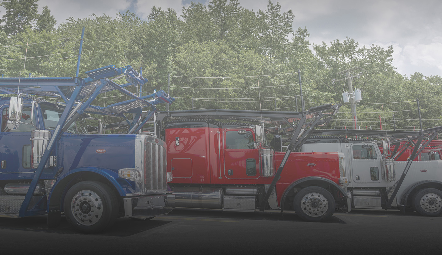 Finance web page photo of three car hauler trucks